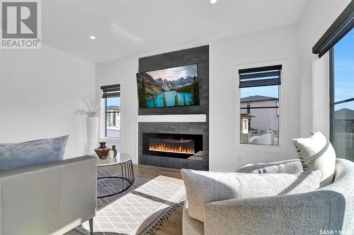 4154 Fieldstone Way, Regina, SK - Indoor Photo Showing Living Room With Fireplace