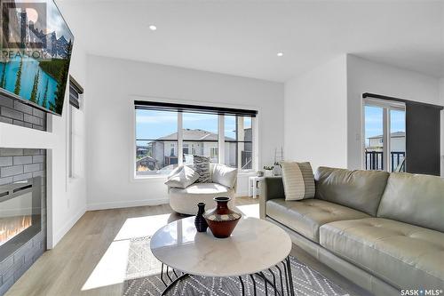 4154 Fieldstone Way, Regina, SK - Indoor Photo Showing Living Room With Fireplace