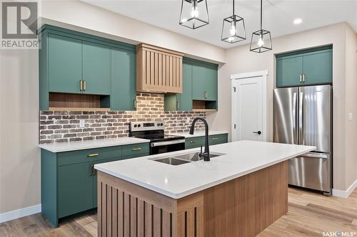 320 Myles Heidt Lane, Saskatoon, SK - Indoor Photo Showing Kitchen With Stainless Steel Kitchen With Double Sink With Upgraded Kitchen