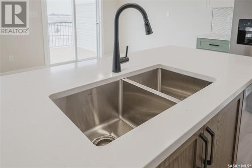 310 Myles Heidt Lane, Saskatoon, SK - Indoor Photo Showing Kitchen With Double Sink