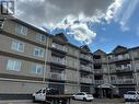 109 1621 Dakota Drive, Regina, SK  - Outdoor With Balcony With Facade 