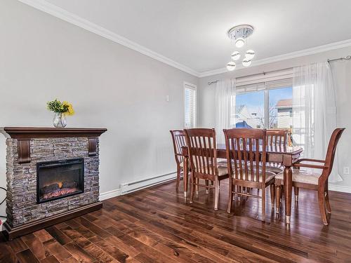 Salle Ã  manger - 161 Rue Des Abbesses, Vaudreuil-Dorion, QC - Indoor Photo Showing Dining Room With Fireplace