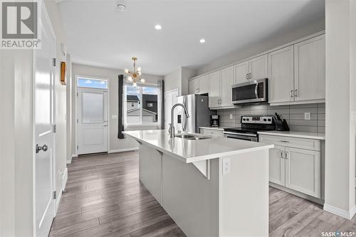 2048 Brighton Common, Saskatoon, SK - Indoor Photo Showing Kitchen With Stainless Steel Kitchen With Double Sink With Upgraded Kitchen