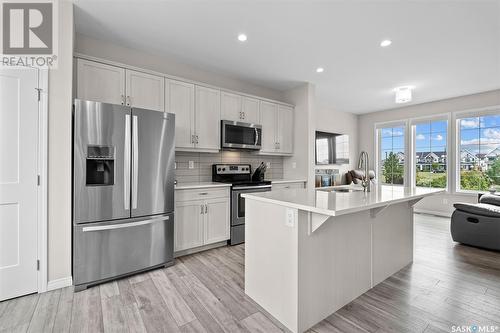 2048 Brighton Common, Saskatoon, SK - Indoor Photo Showing Kitchen With Stainless Steel Kitchen With Upgraded Kitchen