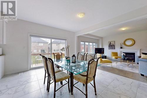 1623 Corsal Court, Innisfil, ON - Indoor Photo Showing Dining Room With Fireplace