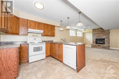 6804 Lakes Park Drive, Ottawa, ON - Indoor Photo Showing Kitchen With Fireplace