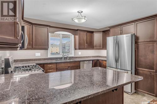 106 3750 Haughton Road E, Regina, SK - Indoor Photo Showing Kitchen With Stainless Steel Kitchen