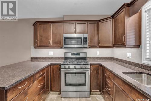 106 3750 Haughton Road E, Regina, SK - Indoor Photo Showing Kitchen With Upgraded Kitchen