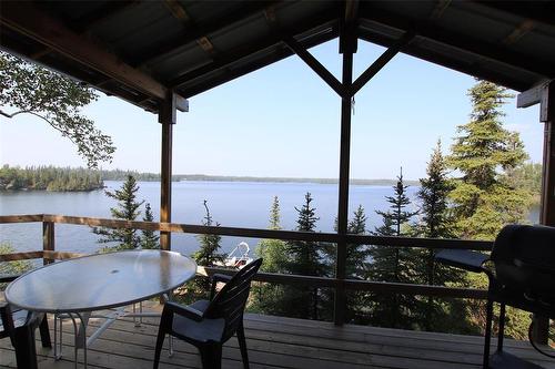 4 Millwater Way, Bakers Narrows, MB - Outdoor With Body Of Water With Deck Patio Veranda With View With Exterior