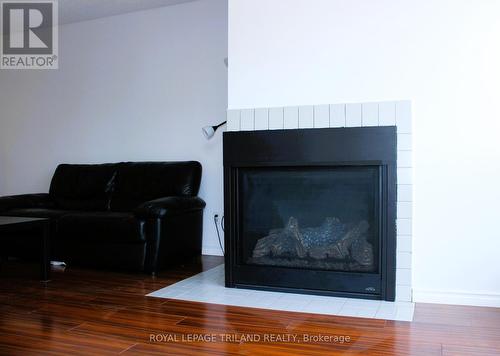 410 - 1 Jacksway Crescent, London, ON - Indoor Photo Showing Living Room With Fireplace