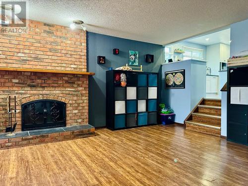 1305 16Th  S Street, Cranbrook, BC - Indoor Photo Showing Living Room With Fireplace