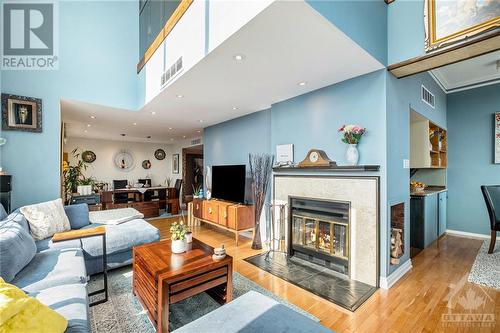 199 Kent Street Unit#Ph2407, Ottawa, ON - Indoor Photo Showing Living Room With Fireplace