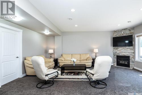 211 Beechdale Court, Saskatoon, SK - Indoor Photo Showing Living Room With Fireplace