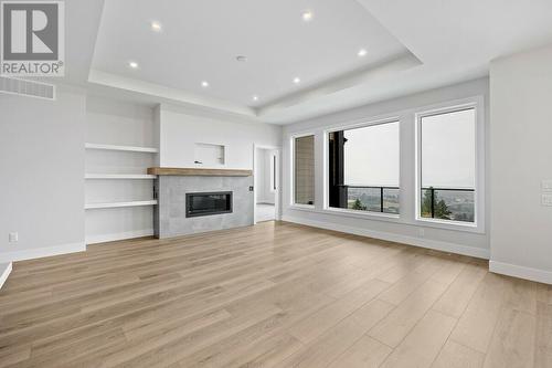 1154 Lone Pine Drive, Kelowna, BC - Indoor Photo Showing Other Room With Fireplace