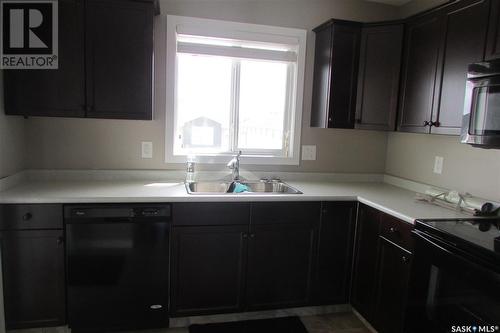 25 4850 Harbour Landing Drive, Regina, SK - Indoor Photo Showing Kitchen With Double Sink