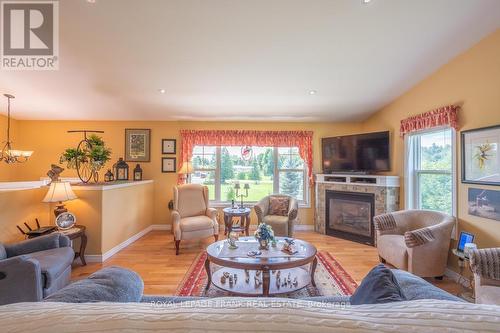 406 Lakehurst Circle Road, Galway-Cavendish And Harvey, ON - Indoor Photo Showing Living Room With Fireplace