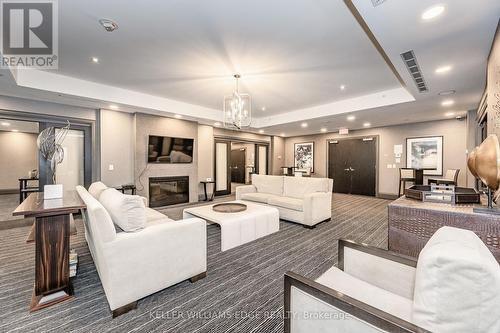 516 - 11 Bronte Road, Oakville, ON - Indoor Photo Showing Living Room With Fireplace