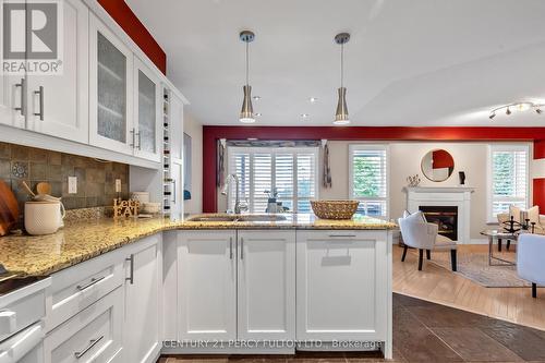 19 Davey Street, Ajax (South East), ON - Indoor Photo Showing Kitchen With Fireplace With Double Sink