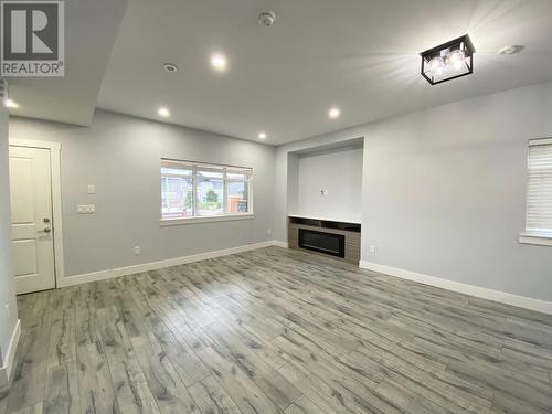 722 Coopland Crescent Unit# 4, Kelowna, BC - Indoor Photo Showing Other Room With Fireplace