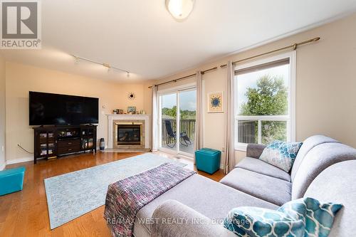 334 Cundles Road E, Barrie (Little Lake), ON - Indoor Photo Showing Living Room With Fireplace