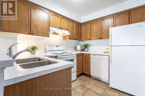 307 - 4450 Fairview Street, Burlington, ON - Indoor Photo Showing Kitchen With Double Sink