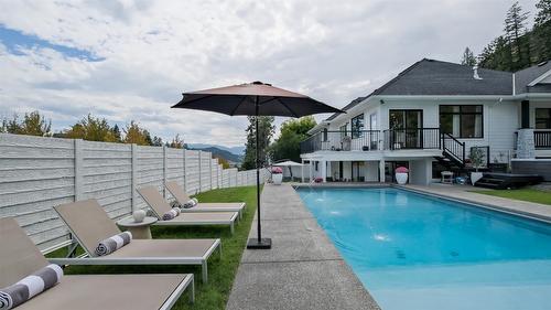 397 Tucker Court, Kelowna, BC - Outdoor With In Ground Pool With Deck Patio Veranda