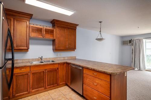 108-1965 Pandosy Street, Kelowna, BC - Indoor Photo Showing Kitchen With Double Sink