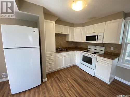 116 4Th Avenue W, Kindersley, SK - Indoor Photo Showing Kitchen With Double Sink