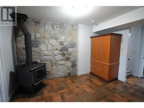 2140 Hadden Court, Kelowna, BC - Indoor Photo Showing Other Room With Fireplace