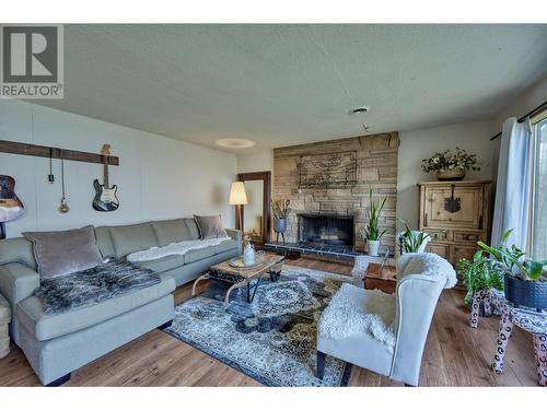 10617 81St Street, Osoyoos, BC - Indoor Photo Showing Living Room With Fireplace