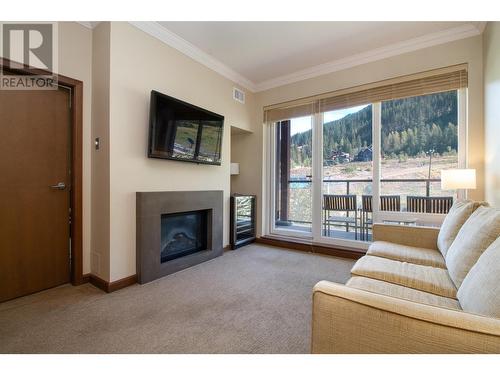 2950 Camozzi Road Unit# 2429, Revelstoke, BC - Indoor Photo Showing Living Room With Fireplace