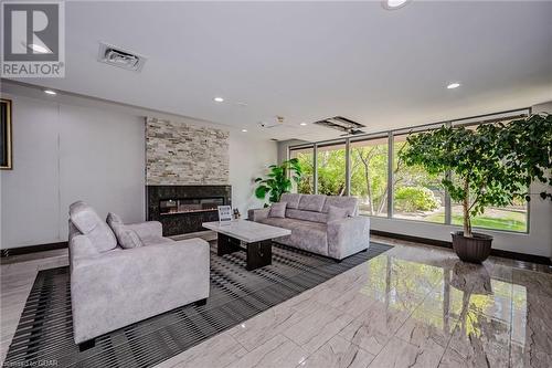 145 Hillcrest Avenue Unit# 2207, Mississauga, ON - Indoor Photo Showing Living Room With Fireplace