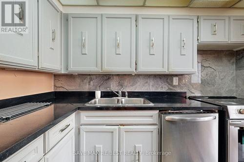 1111 - 3590 Kaneff Crescent, Mississauga (City Centre), ON - Indoor Photo Showing Kitchen With Double Sink