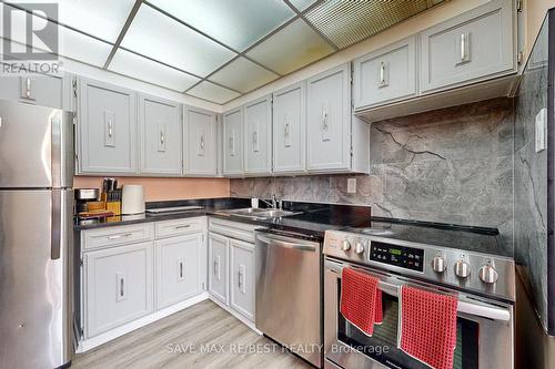 1111 - 3590 Kaneff Crescent, Mississauga (City Centre), ON - Indoor Photo Showing Kitchen With Stainless Steel Kitchen With Double Sink