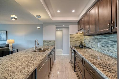 Looking from window area to interior of unit. - 120 Duke Street|Unit #1506, Hamilton, ON - Indoor Photo Showing Kitchen With Double Sink With Upgraded Kitchen