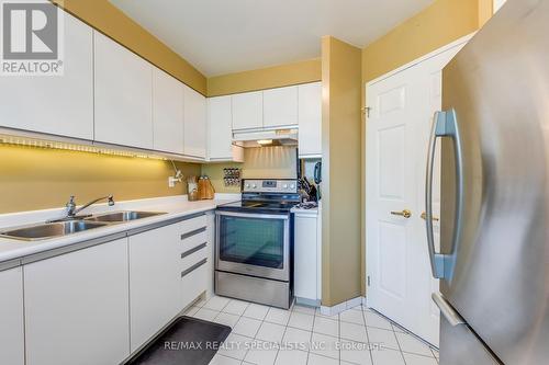 404 - 2177 Burnhamthorpe Road W, Mississauga, ON - Indoor Photo Showing Kitchen With Double Sink