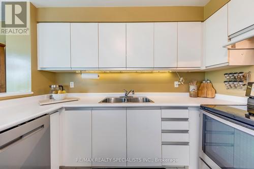 404 - 2177 Burnhamthorpe Road W, Mississauga, ON - Indoor Photo Showing Kitchen With Double Sink