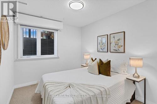 103 - 1210 Main Street E, Milton (Dempsey), ON - Indoor Photo Showing Bedroom