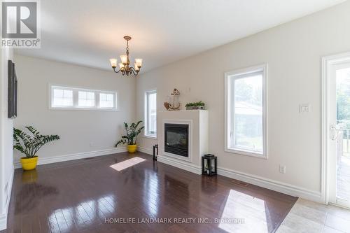 553 Carriage Lane, Peterborough, ON - Indoor Photo Showing Living Room With Fireplace