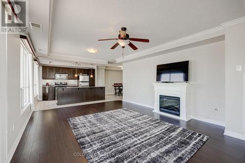 410 - 1030 Coronation Drive, London, ON - Indoor Photo Showing Living Room With Fireplace