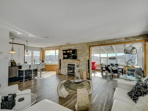 Vue d'ensemble - 1000 Rue Des Tournesols, Sainte-Adèle, QC - Indoor Photo Showing Living Room With Fireplace