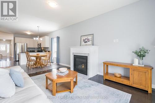 8 Orleans Avenue, Barrie (Innis-Shore), ON - Indoor Photo Showing Living Room With Fireplace