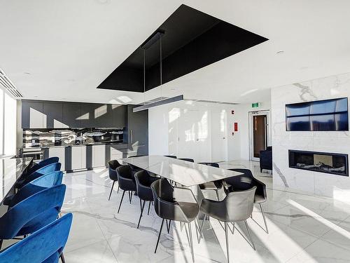 Conference room - 401-1025 Rue De La Commune E., Montréal (Ville-Marie), QC - Indoor Photo Showing Dining Room With Fireplace