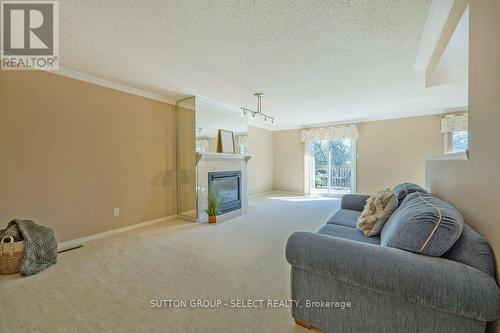 34 - 14 Doon Drive, London, ON - Indoor Photo Showing Living Room With Fireplace