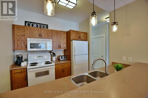 117 - 125 Fairway Court, Blue Mountains (Blue Mountain Resort Area), ON - Indoor Photo Showing Kitchen With Double Sink