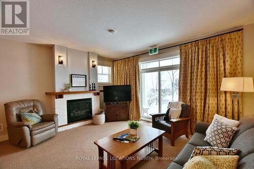 117 - 125 Fairway Court, Blue Mountains (Blue Mountain Resort Area), ON - Indoor Photo Showing Living Room With Fireplace