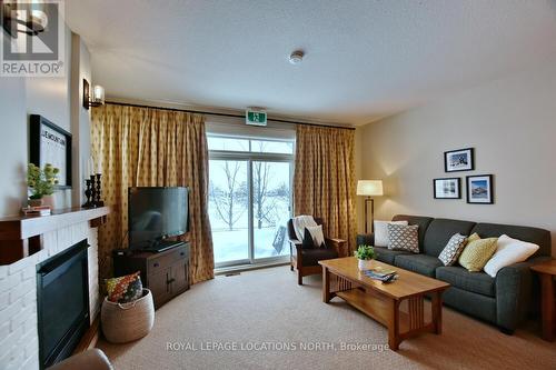 117 - 125 Fairway Court, Blue Mountains (Blue Mountain Resort Area), ON - Indoor Photo Showing Living Room With Fireplace