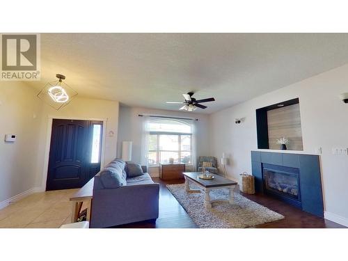 10503 114A Avenue, Fort St. John, BC - Indoor Photo Showing Living Room With Fireplace