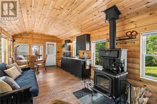 1161 Richmond Road, Central Frontenac (Frontenac Centre), ON - Indoor Photo Showing Living Room With Fireplace