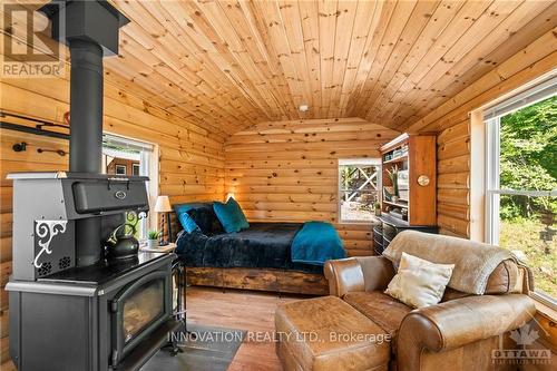 1161 Richmond Road, Central Frontenac (Frontenac Centre), ON - Indoor Photo Showing Living Room With Fireplace